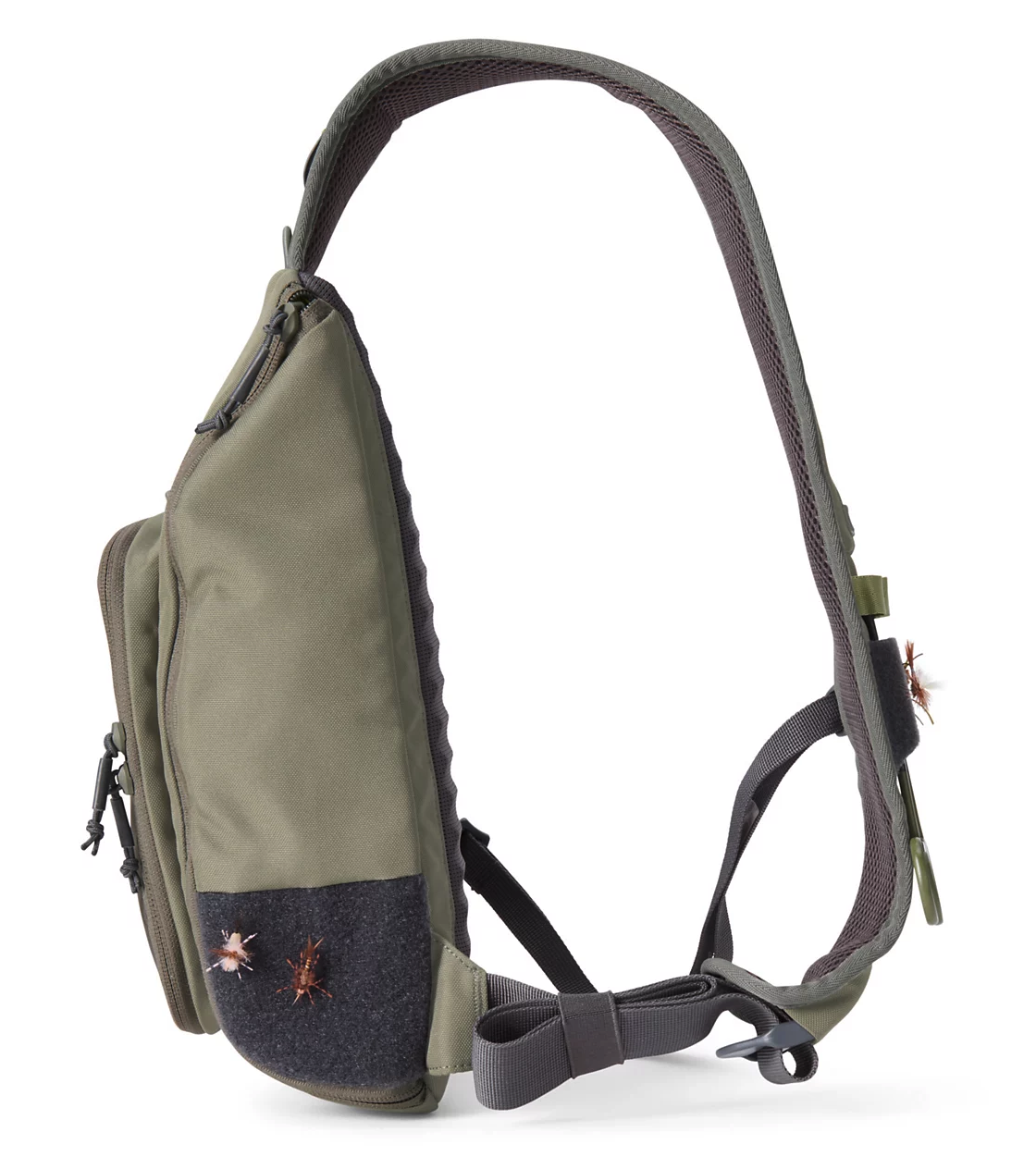 Side view of  Orvis Mini Sling Pack Dusty Olive with flies on patch
