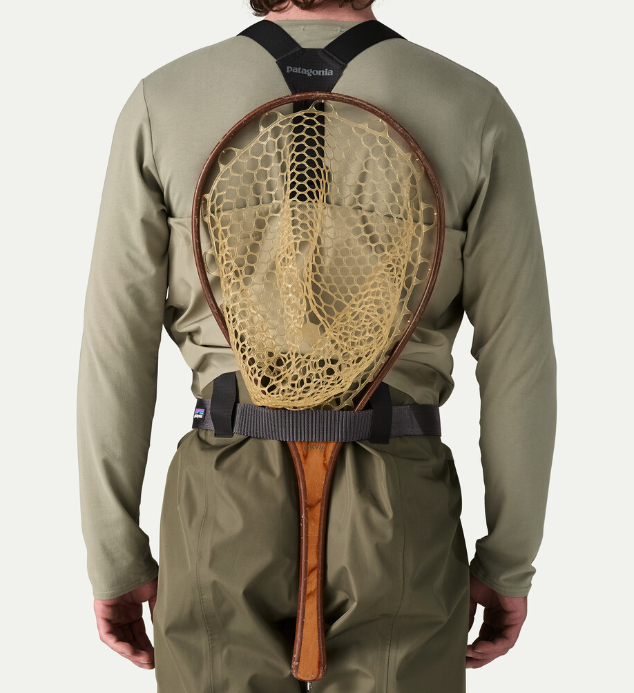 Patagonia Secure Stretch Wading Belt on waders holding a fishing net