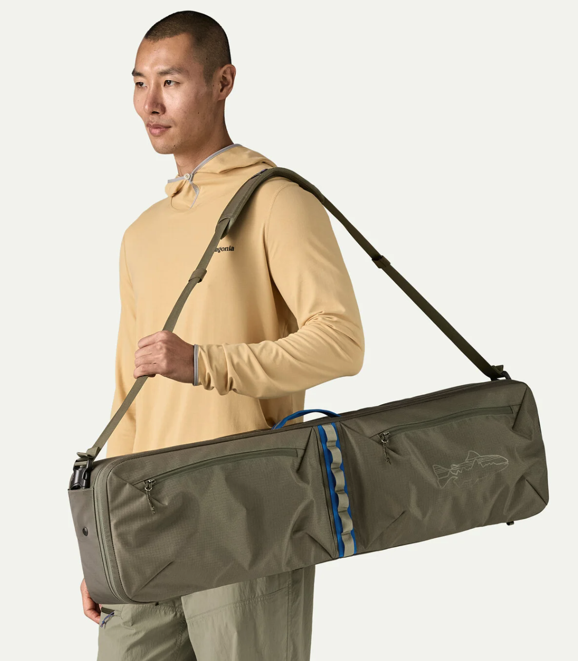 Man with Patagonia Black Hole Rod Case shoulder strap