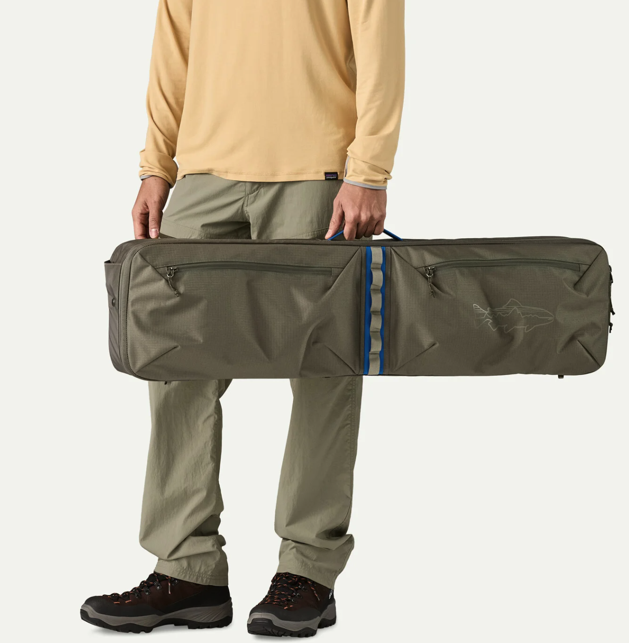 Man holding Patagonia Black Hole Rod Case
