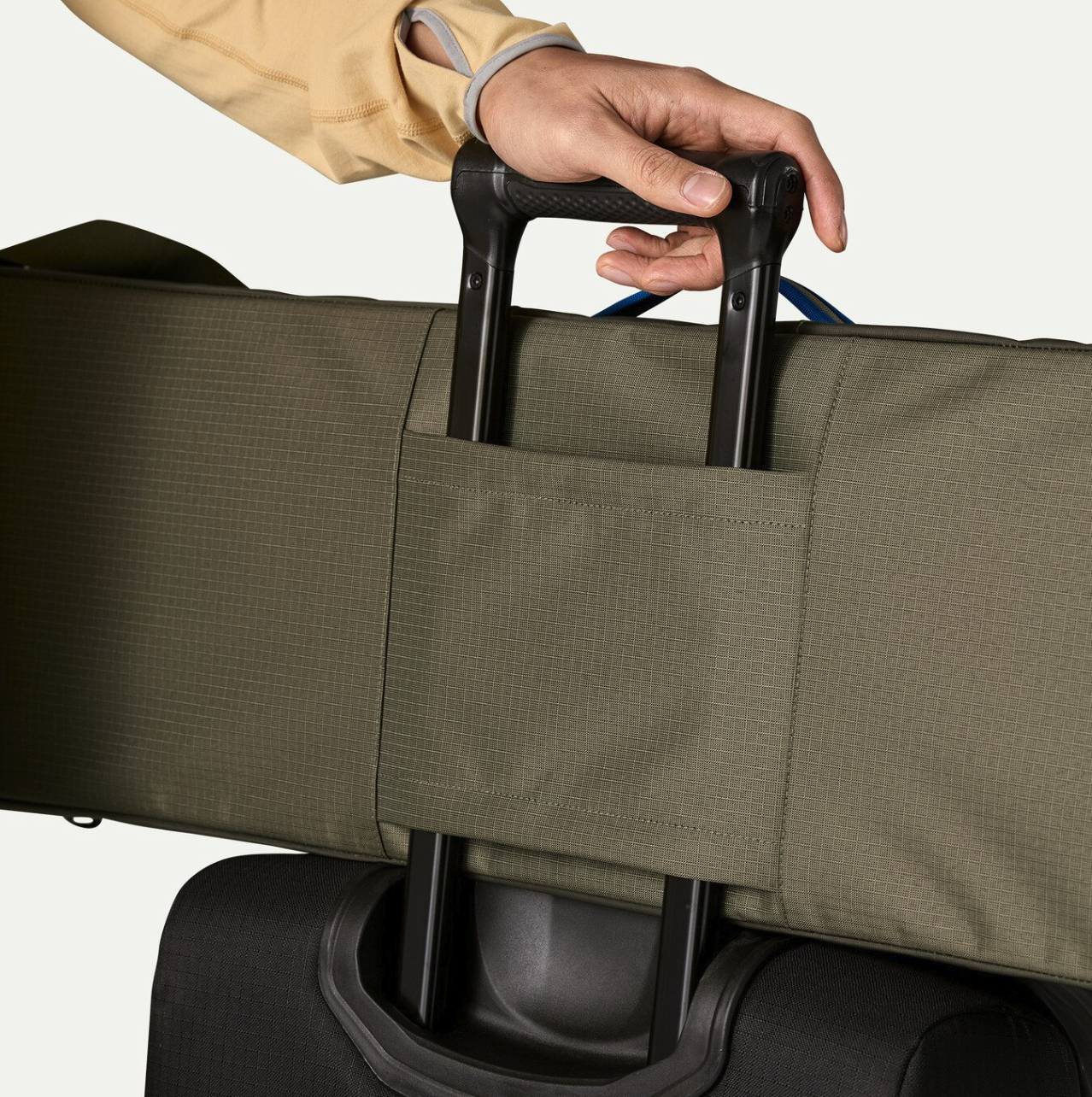 Patagonia Black Hole Rod Case on roller bag detail