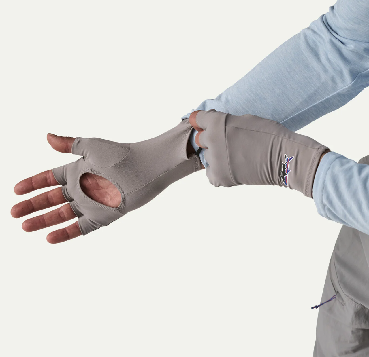 Patagonia Sun Gloves FEGY Model pulling gloves on