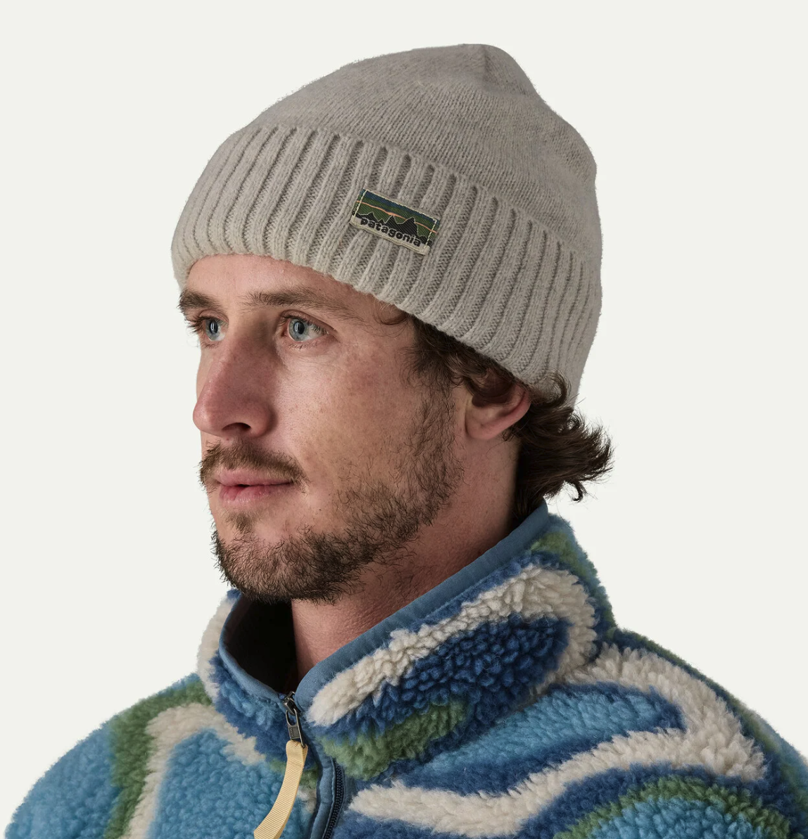 Patagonia Brodeo Beanie Oatmeal Heather warm recycled wool fishing hat with cuffed design worn by man outdoors