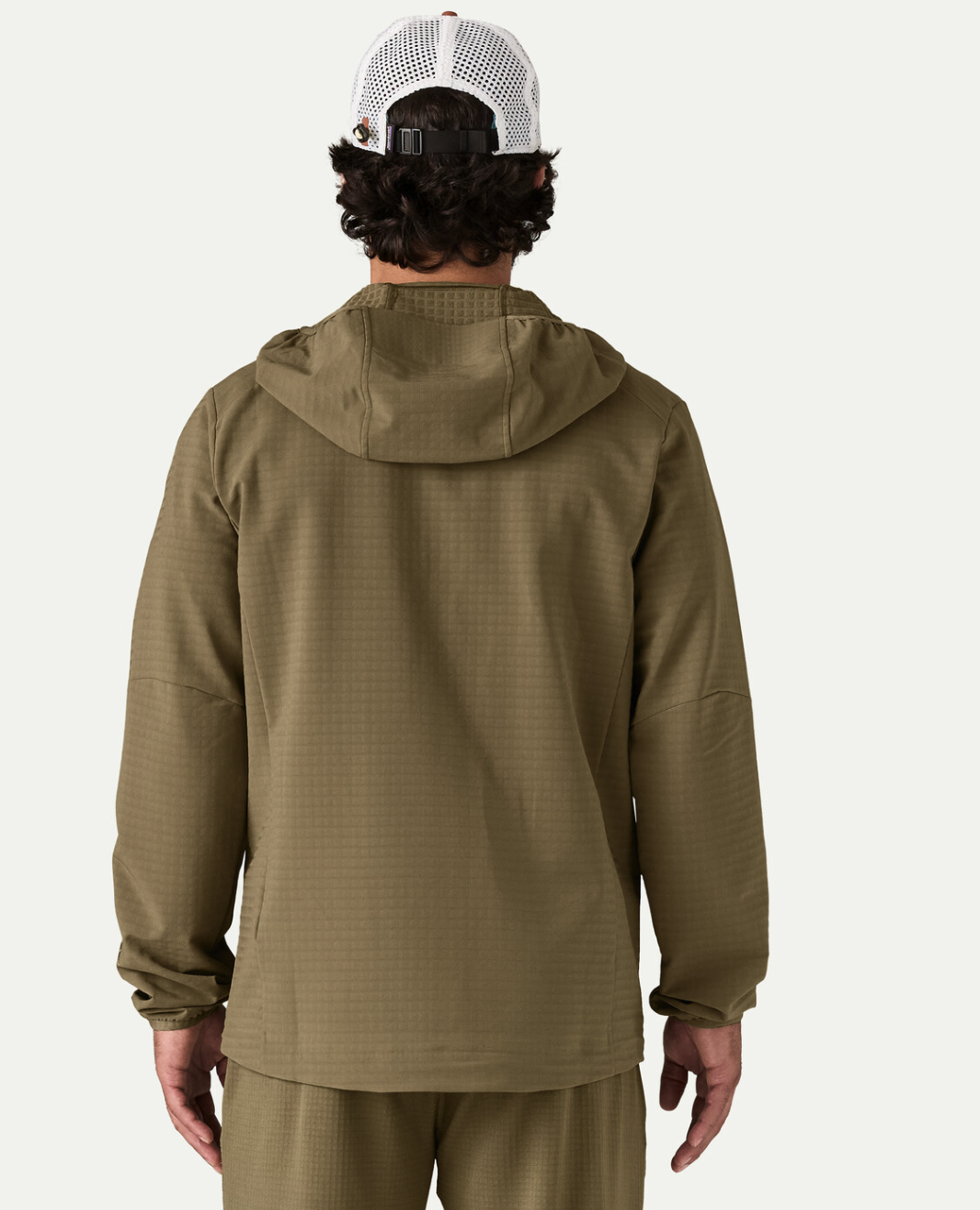 Rear view of model wearing Patagonia R1 TechFace Fitz Roy Trout Hoody Dark Ash color.