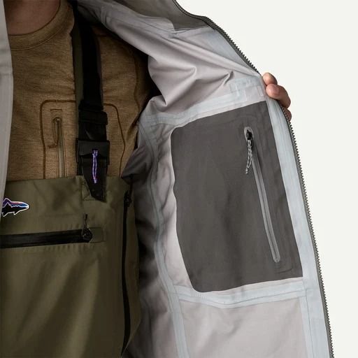 Waterproof breathable fishing jacket with interior gear storage for river, camp, and outdoor use