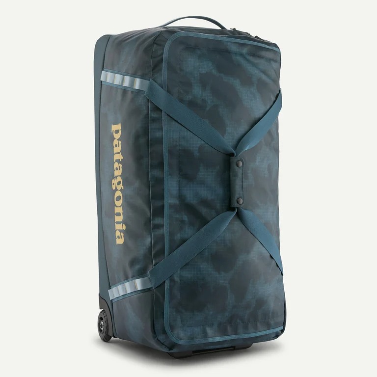 Patagonia Black Hole Wheeled Duffel bag in use, perfect for long trips and outdoor expeditions.