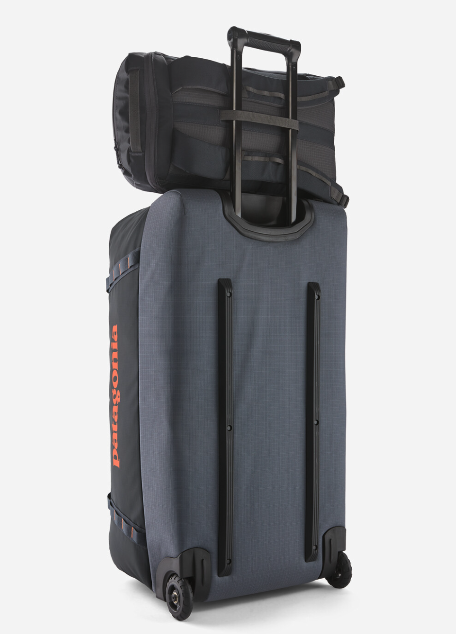 Patagonia Black Hole Duffel with reinforced handles and wheels for easy transport during travel.