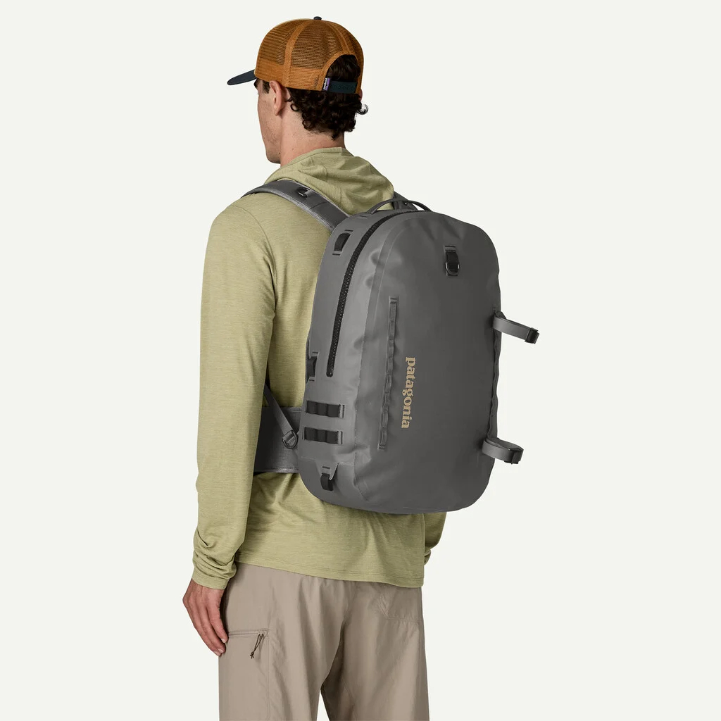 Patagonia Guidewater Backpack 25L worn on back for waterproof fishing, hiking, and camping gear storage
