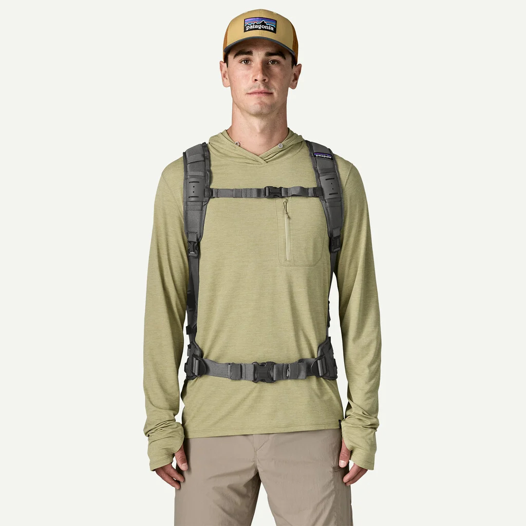 Angler wearing Patagonia Guidewater Backpack 25L with padded shoulder straps and hip belt for outdoor travel