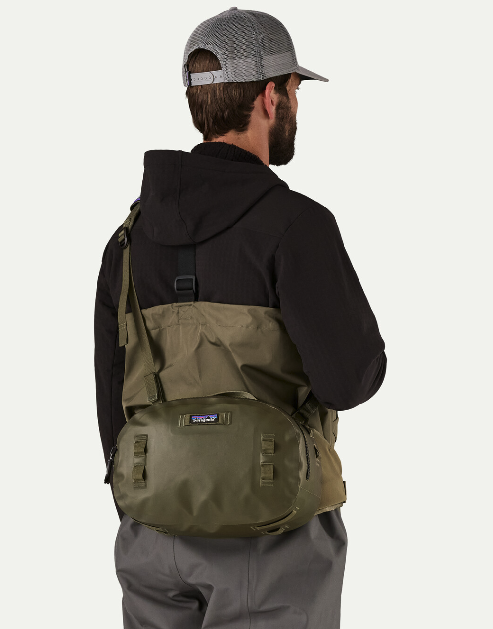 Rear of angler with  Patagonia Guidewater Hip Pack Basin Green around waist.
