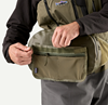 Angler wearing and opening  Patagonia Guidewater Hip Pack Basin Green