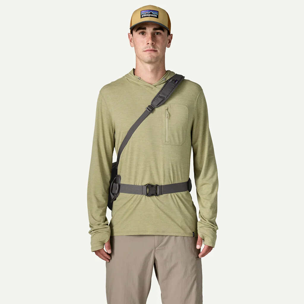 Angler wearing Patagonia Guidewater Switch Pack 12L as a waterproof fly fishing hip pack with shoulder strap