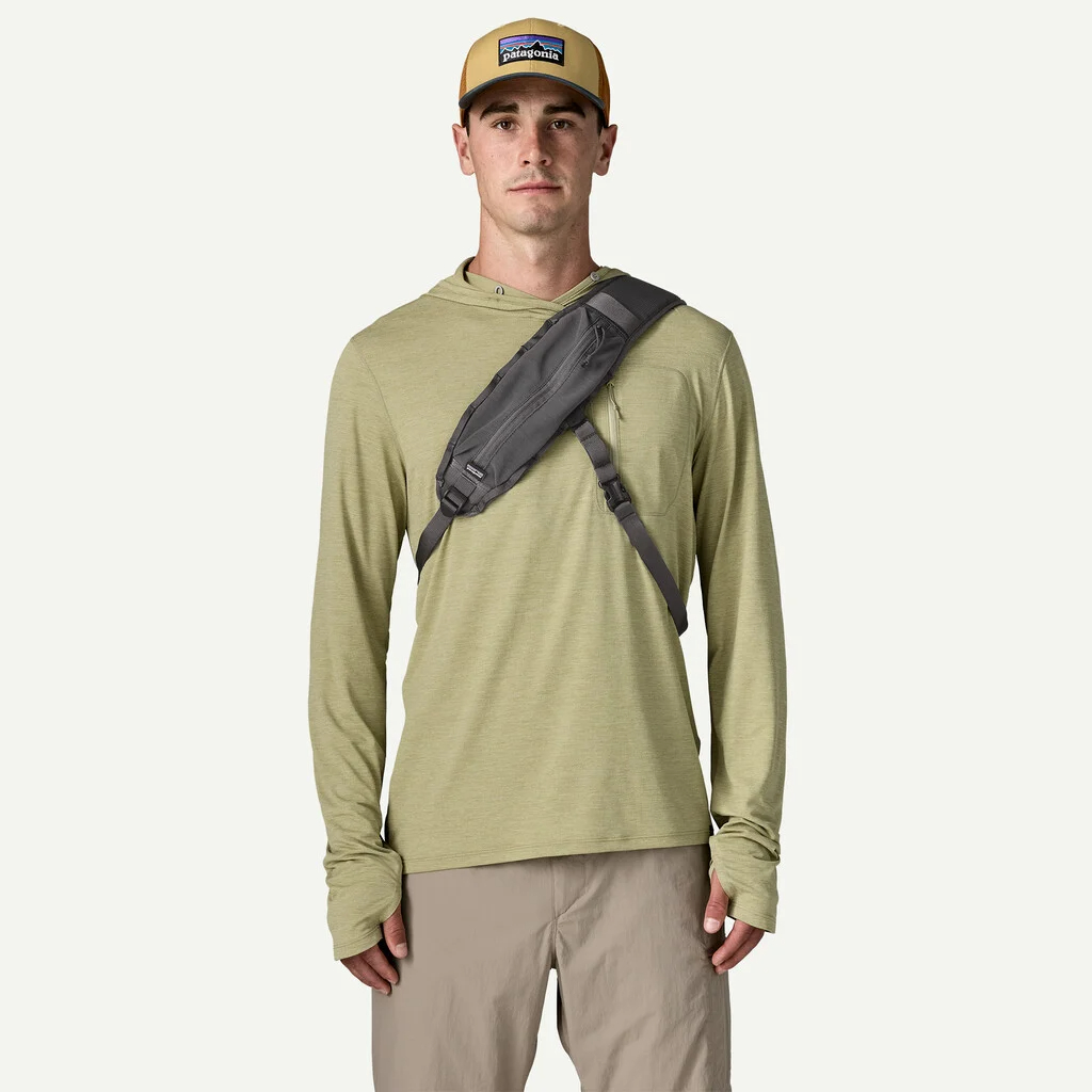 Angler wearing Patagonia Guidewater Switch Pack 12L as a front sling pack for quick fly fishing gear access