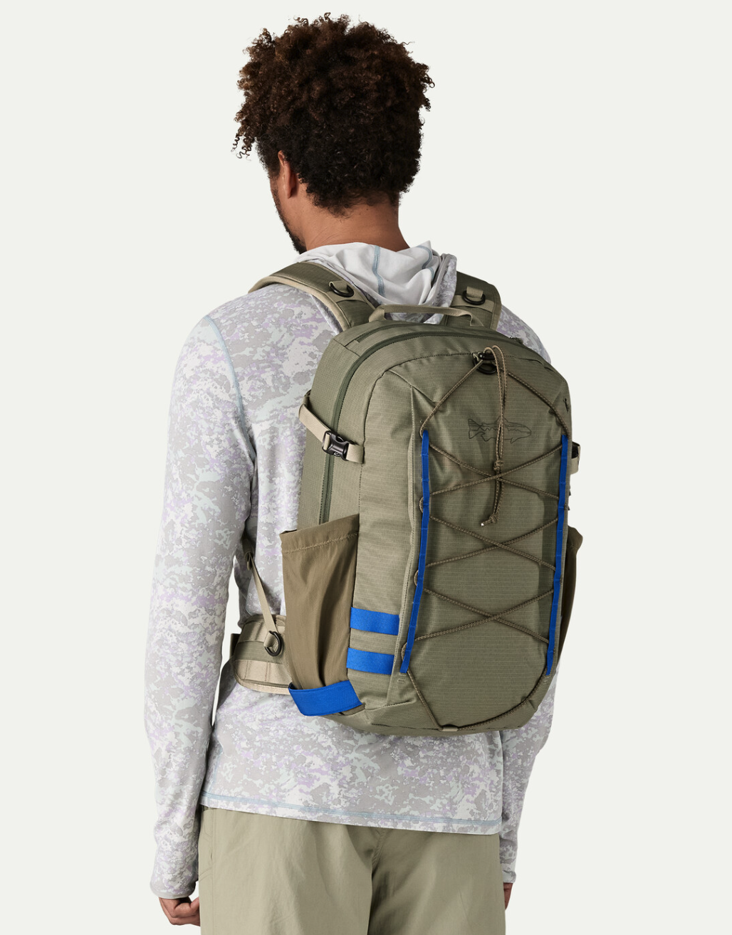 Man wearing Patagonia Stealth Backpack 25L.