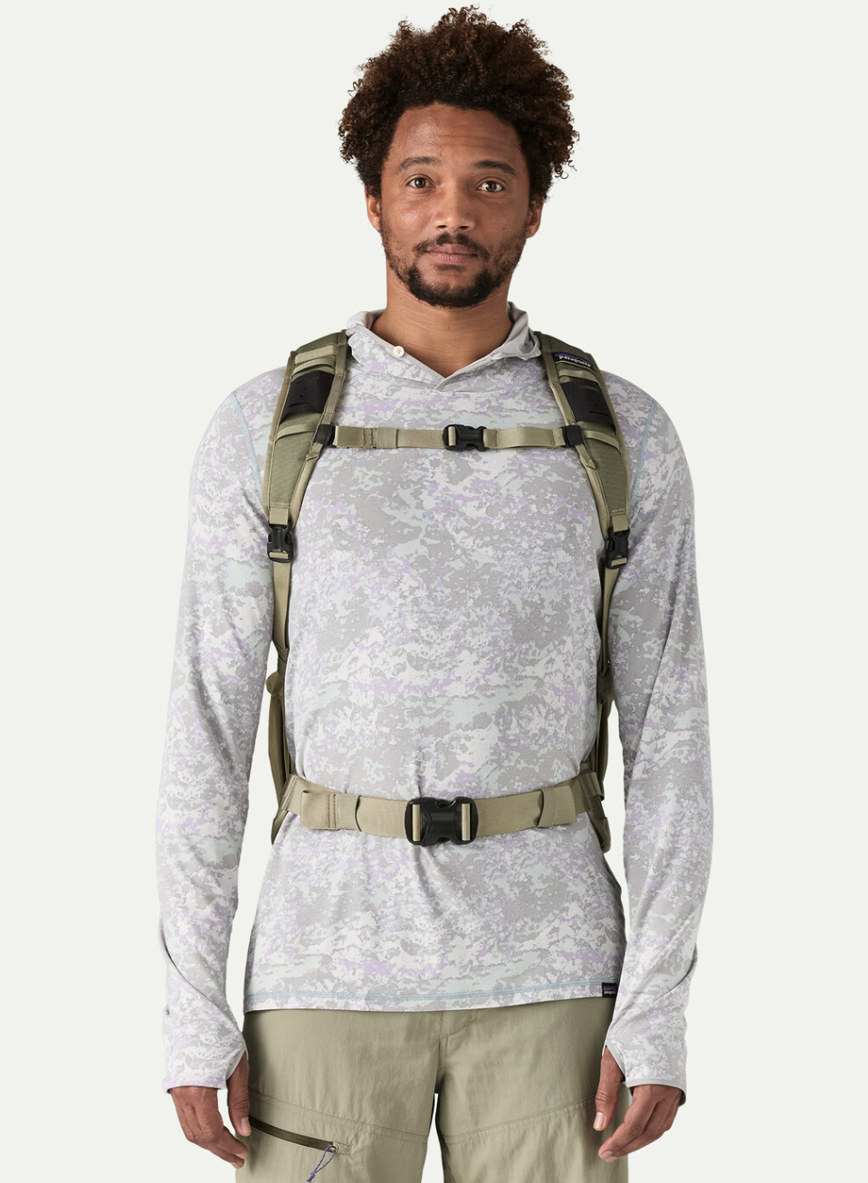 Front view of man wearing Patagonia Stealth Backpack 25L