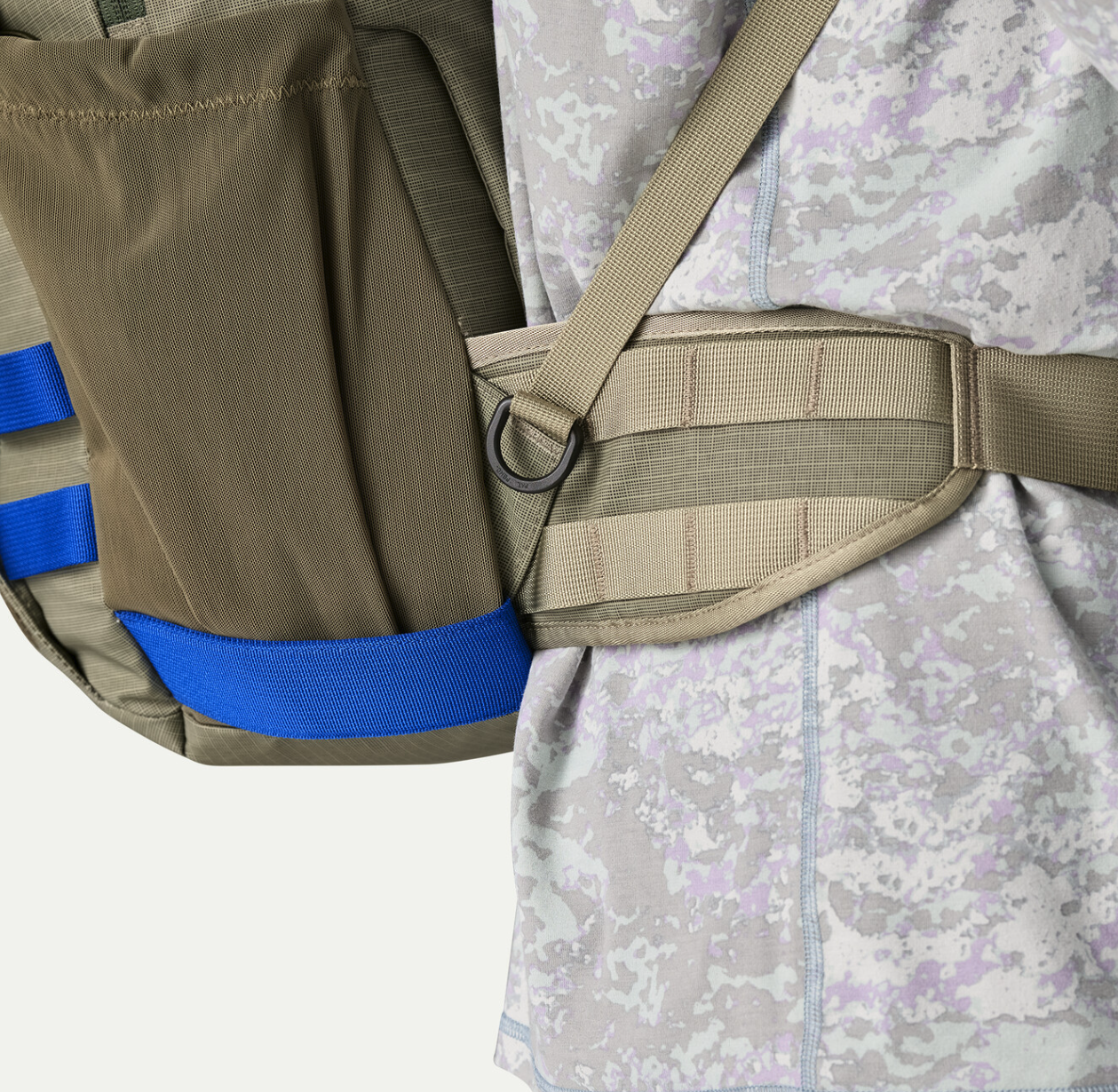 Side belt strap detail of Patagonia Stealth Backpack 25L on man.