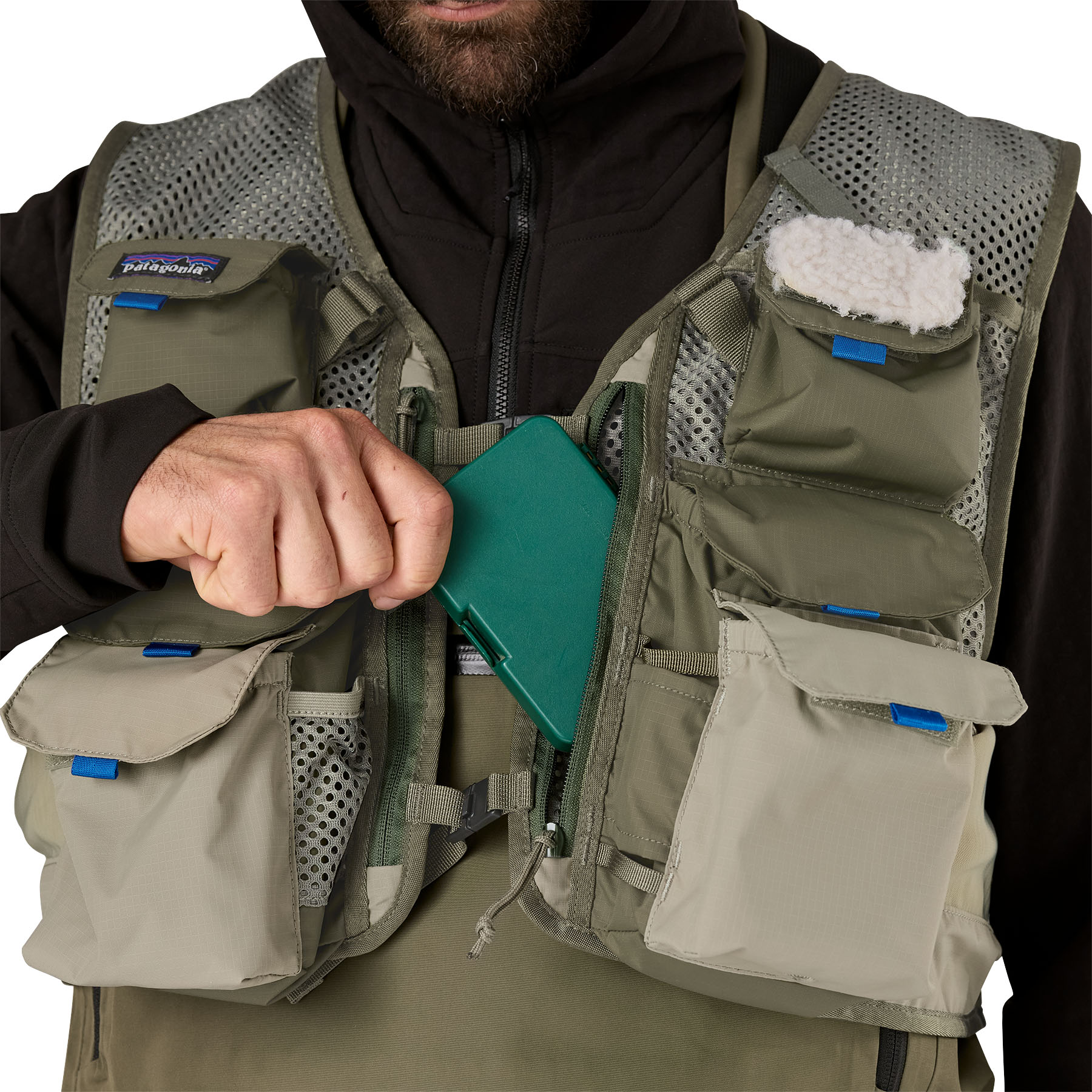 Model showing deep fly box pockets on Patagonia's Stealth Pack Vest