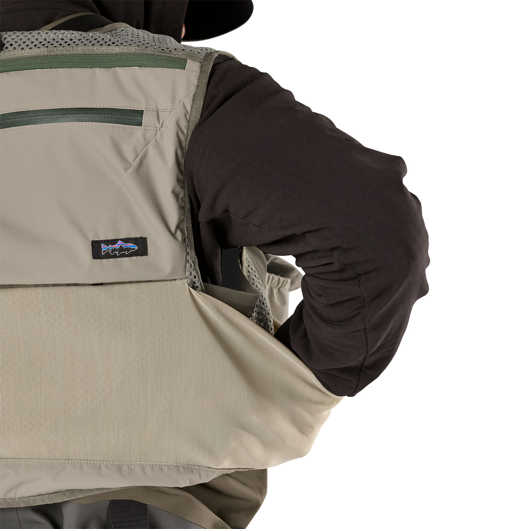 Model showing large rear back pocket on Patagonia's Stealth Pack Vest