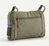 Back of Patagonia Stealth Switch Fishing Pack 3L in river rock green color.