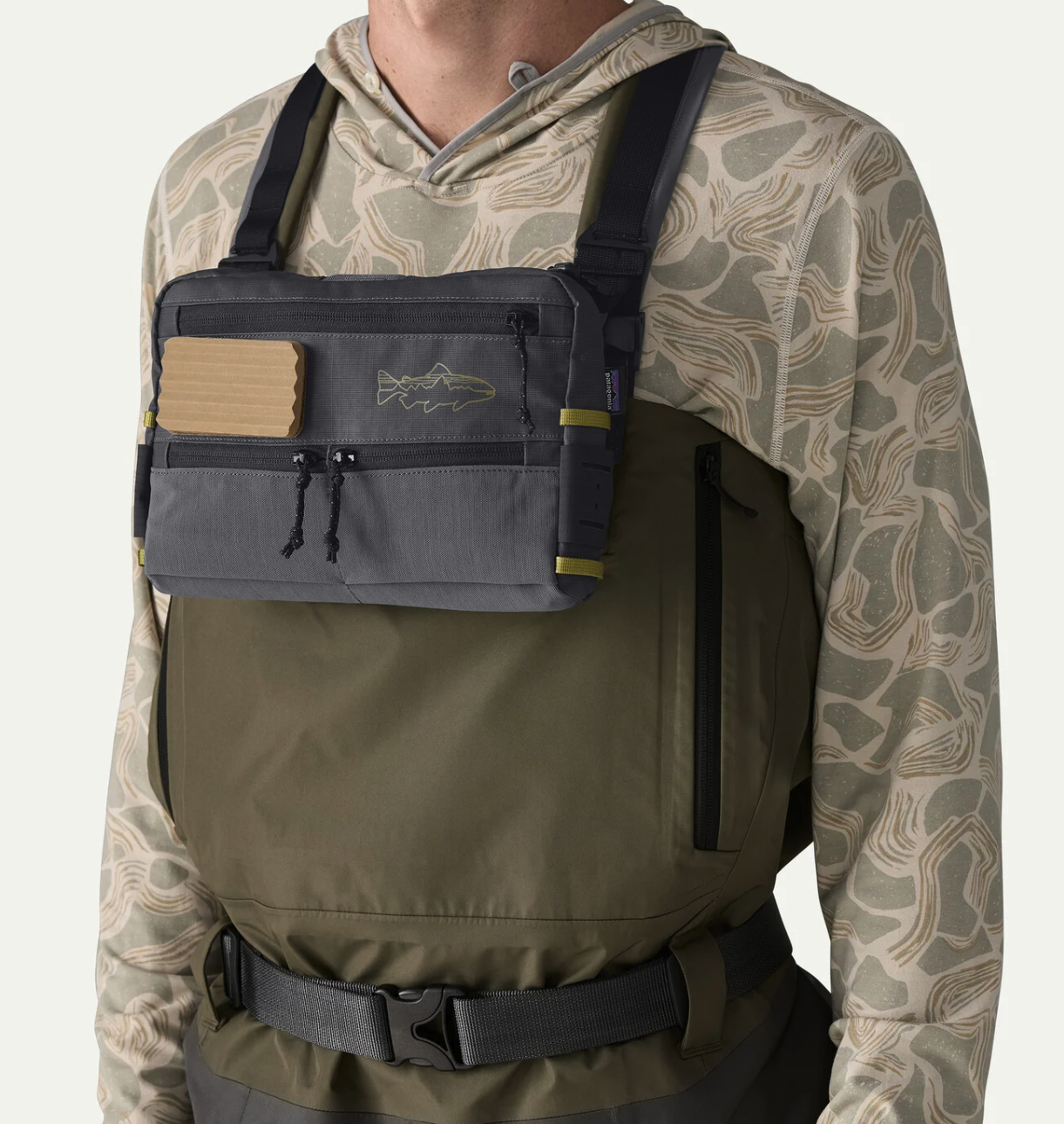 Patagonia Stealth Switch Fishing Pack 3L on front of man wearing waders
