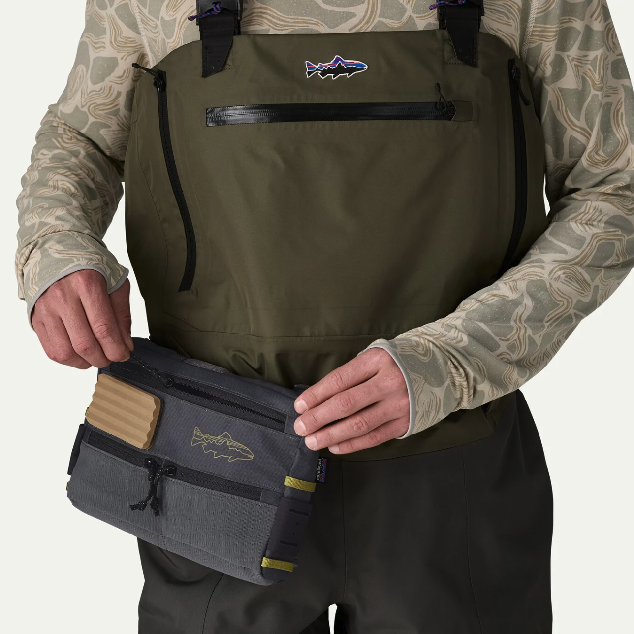 Patagonia Stealth Switch Fishing Pack 3L on hip side of man wearing waders