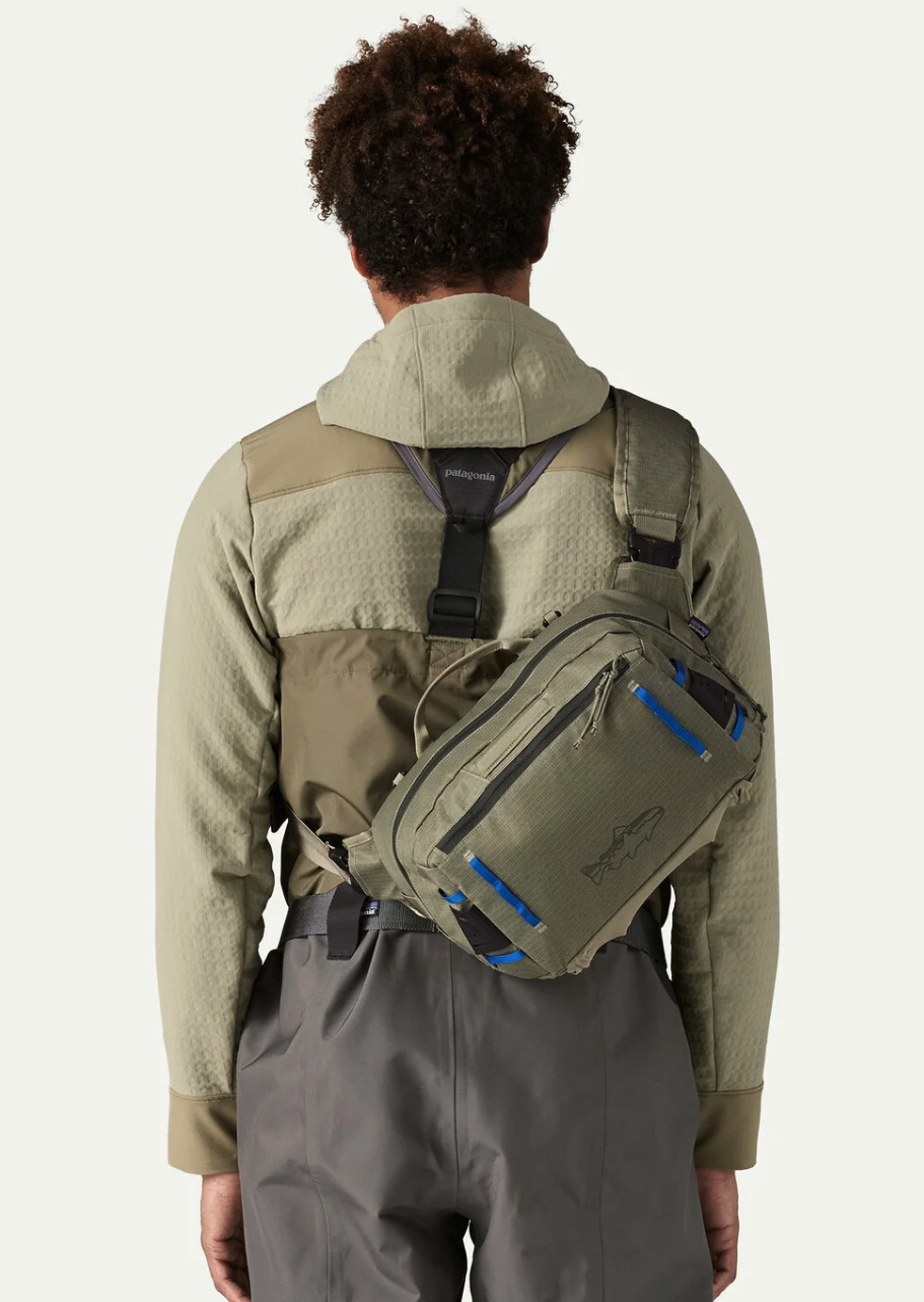 Back of model wearing Patagonia Stealth Switch Fishing Pack 9L over shoulder