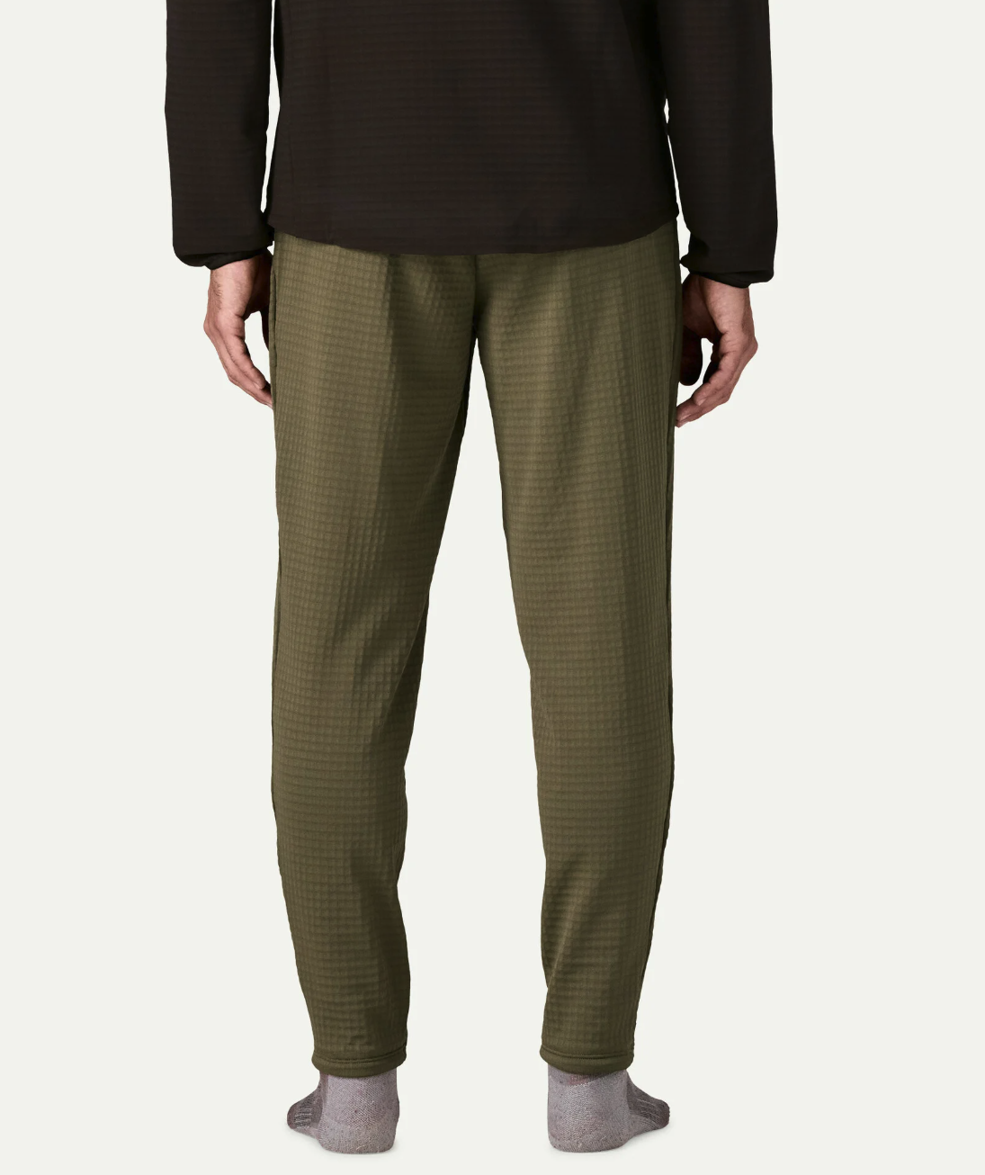 Back of model wearing Patagonia R1 Fleece Pants