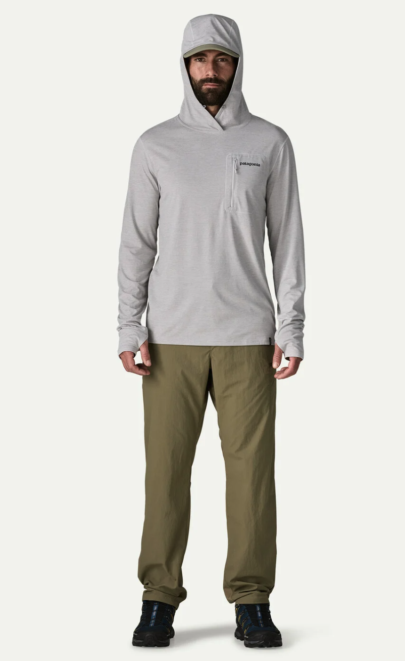 Model wearing Patagonia Men's Sandy Cay Pants with hoody