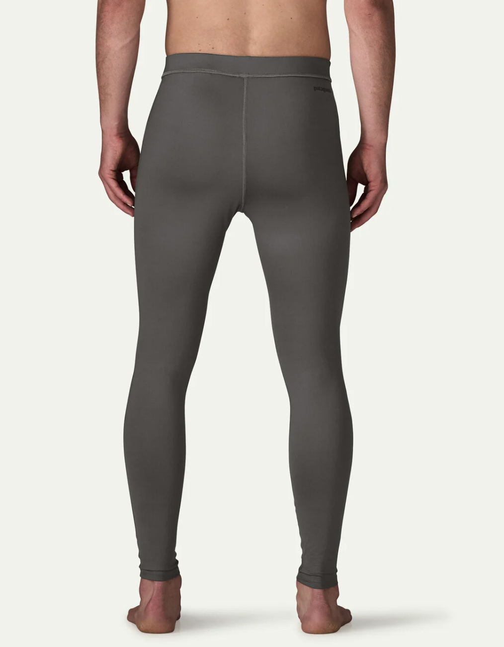 Back of model wearing Patagonia Men's Tropic Comfort Sun Tights