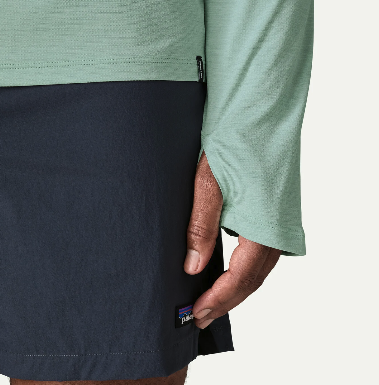 Hand cuff detail of model wearing Patagonia Capilene Cool Sun Hoody TBIX