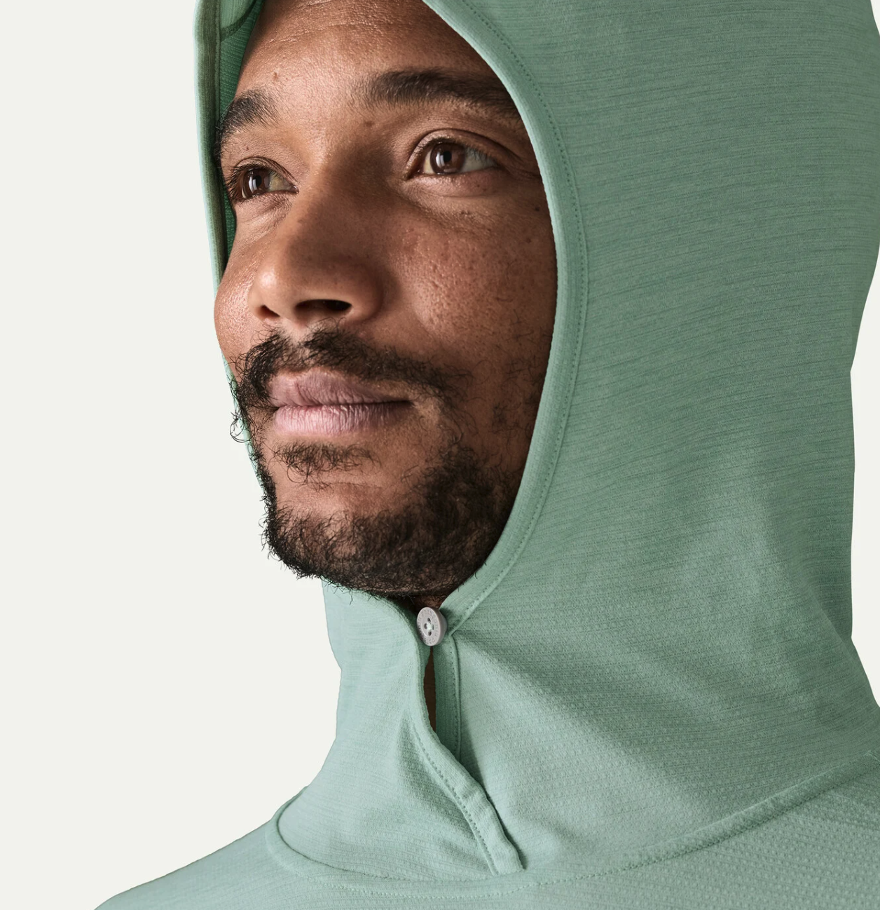 Hood up and snapped on model wearing Patagonia Capilene Cool Sun Hoody TBIX color