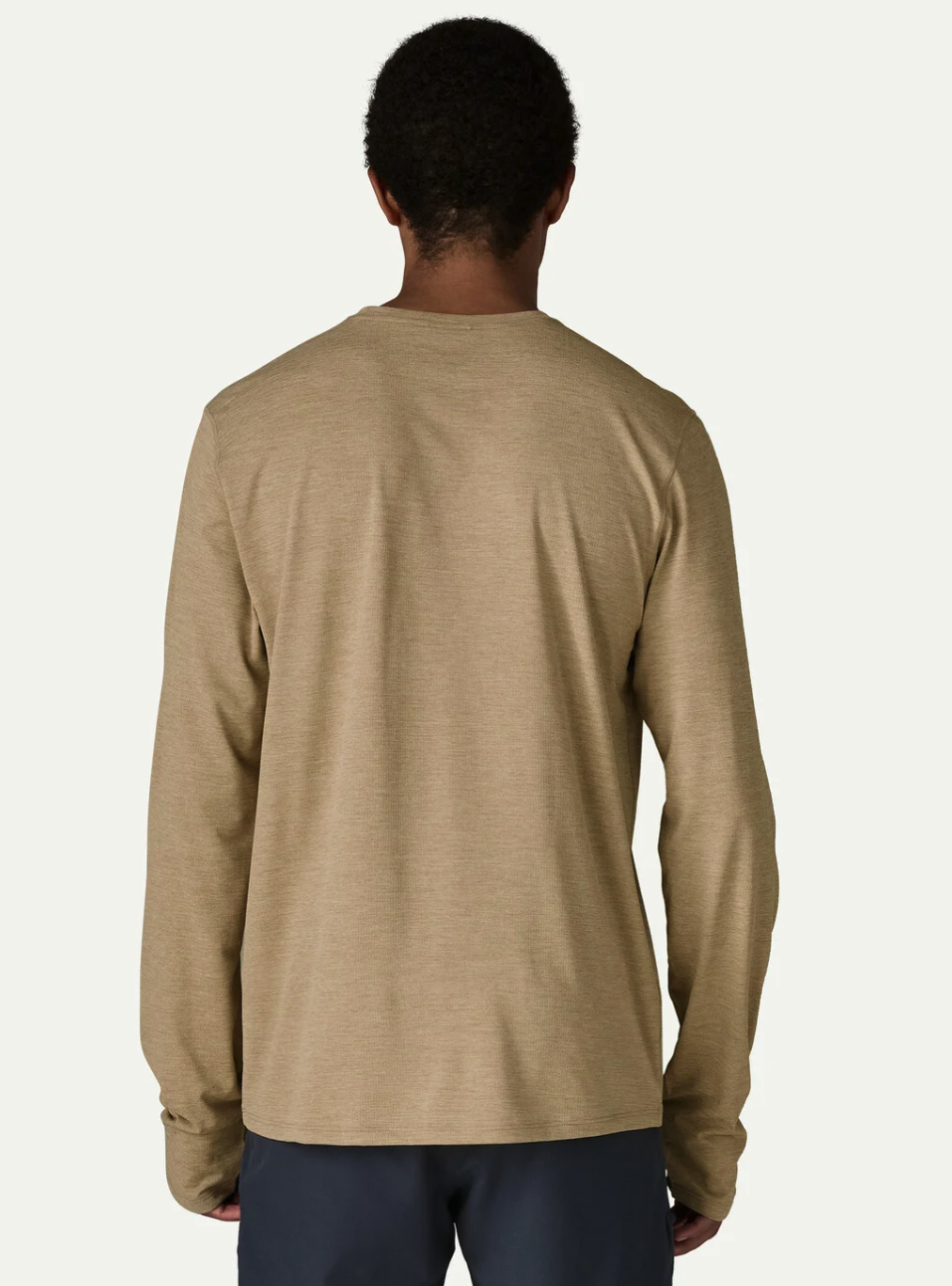 Back of Model wearing Patagonia Long Sleeved Capilene Cool Sun Shirt
