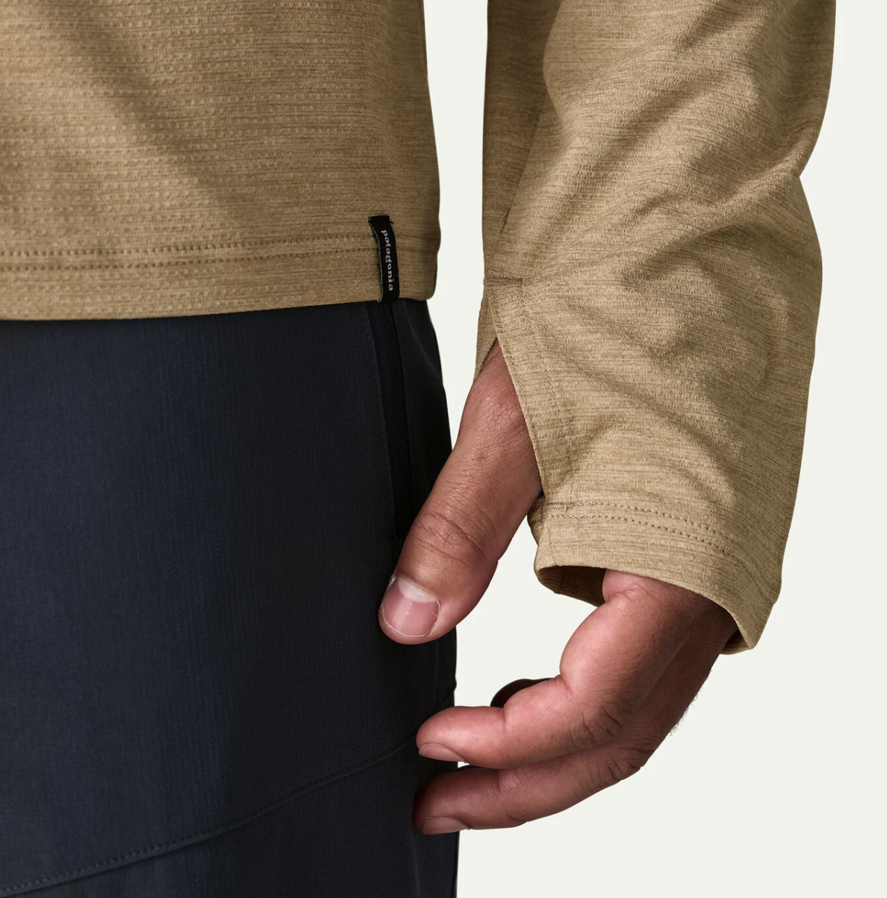 Hand cover detail of Model wearing Patagonia Long Sleeved Capilene Cool Sun Shirt