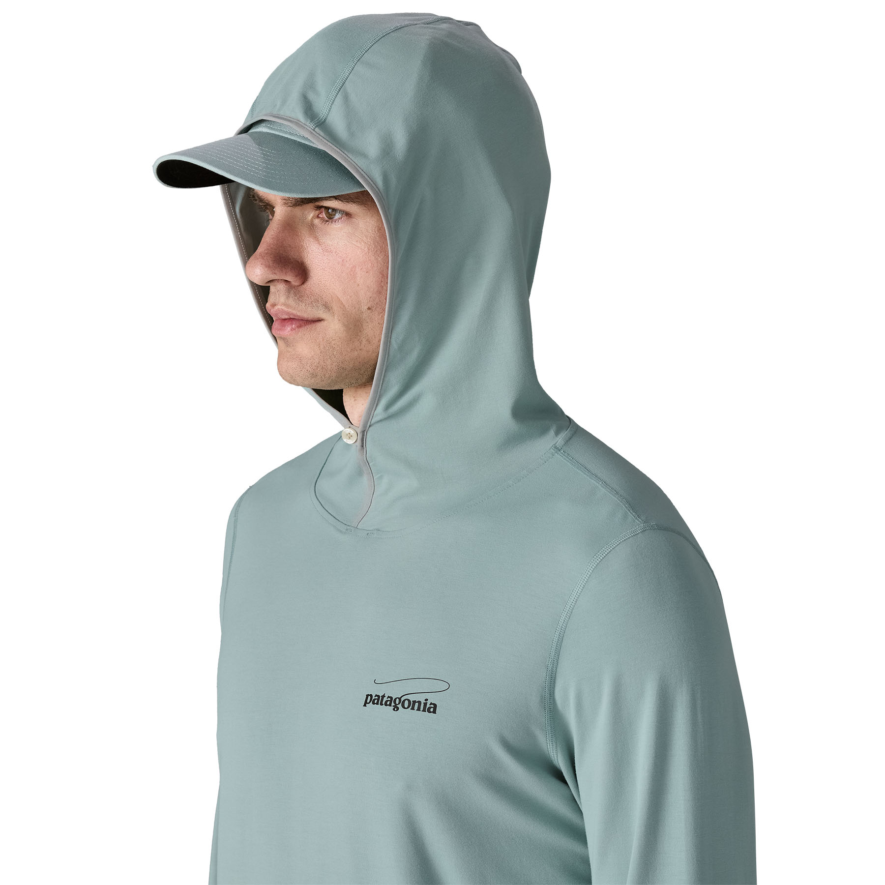 Model showing hood that fits for hat featured on Patagonia's Men's Tropic Comfort Natural Graphic Sun Hoody