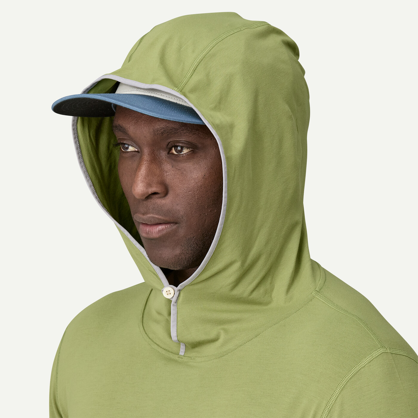 Model showing the hood of the  Patagonia Tropic Comfort Natural Hoody