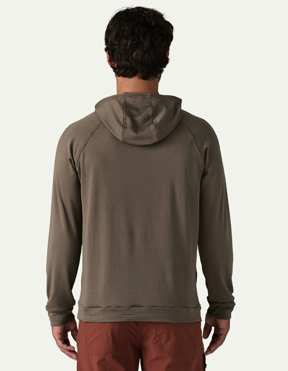 Back of model wearing Patagonia Capilene Thermal Hoody