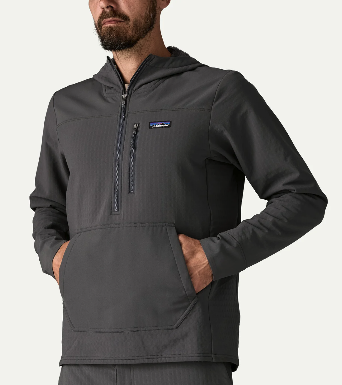 Man with hands in front pockets of Patagonia R2 TechFace Pullover