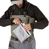 Model showing  dry storage pocket on the chest of Patagonia's Swiftcurrent Expedition Wader