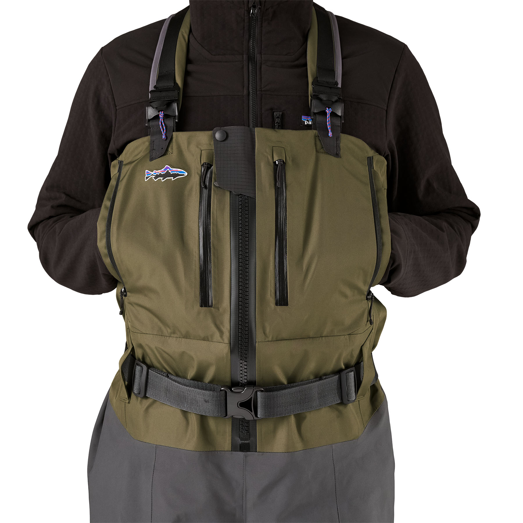 Model highlighting the large fleece lined hand pockets on Patagonia's Swiftcurrent Expedition Zip-Front Wader