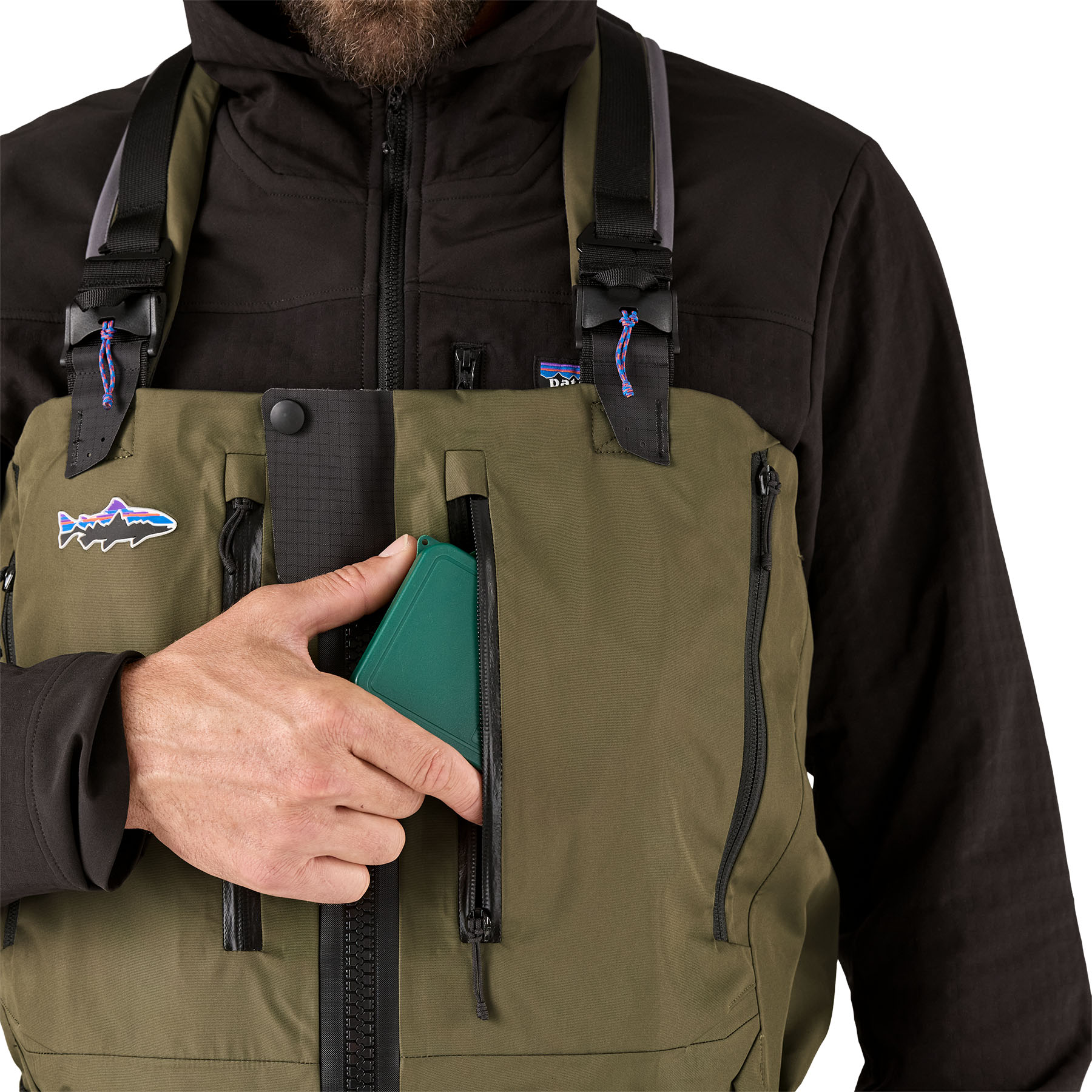 Model showing storage pockets on the chest of Patagonia's Swiftcurrent Expedition Zip-Front Wader