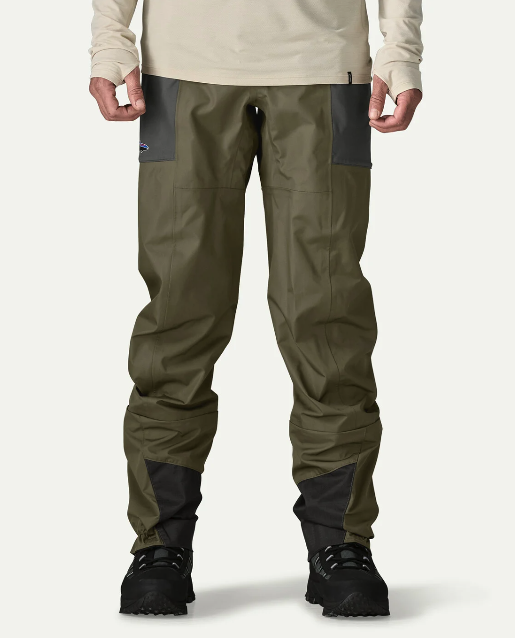 Lower front of model wearing  Patagonia Swiftcurrent Traverse Wading Pants