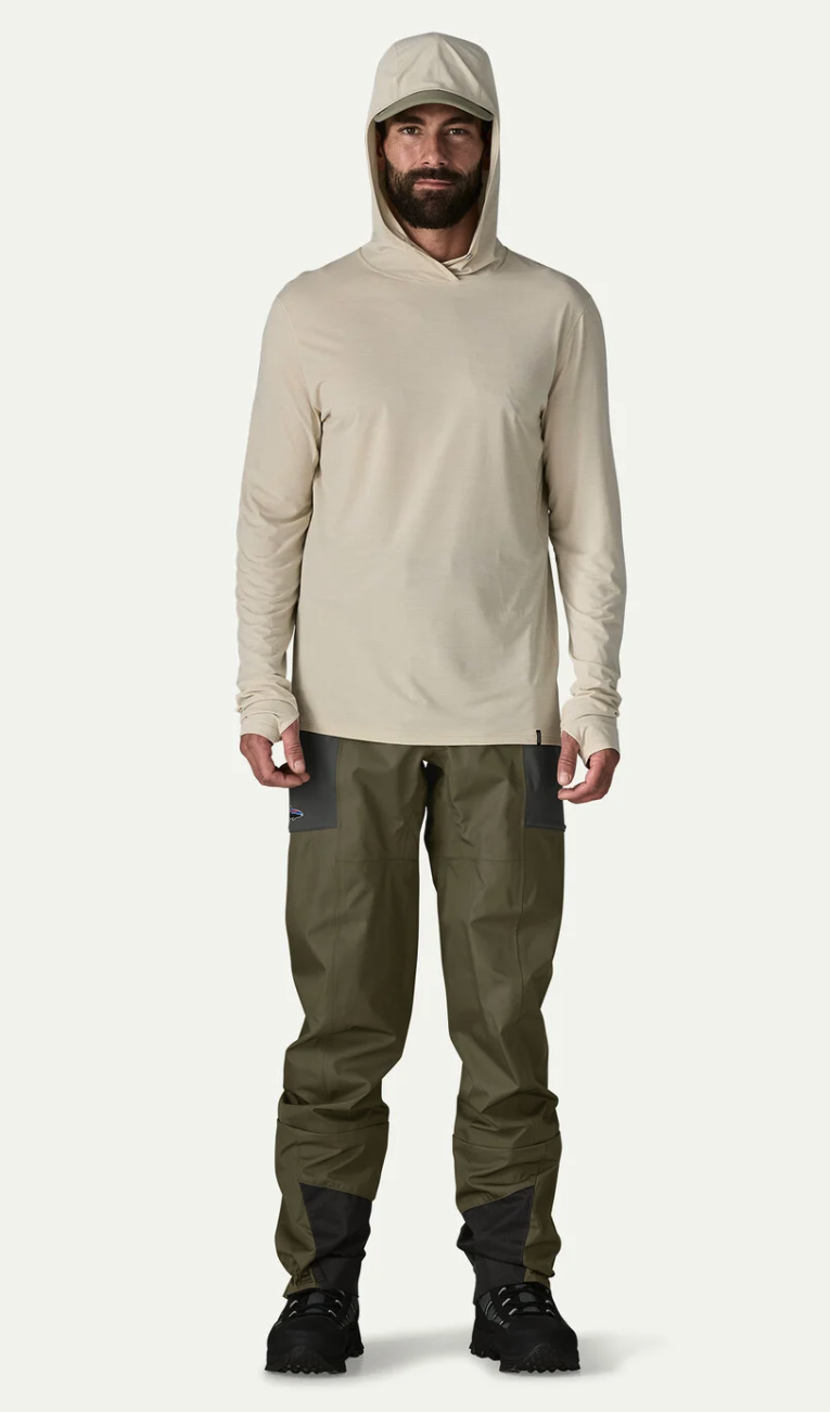 Model wearing  Patagonia Swiftcurrent Traverse Wading Pants with sun hoody