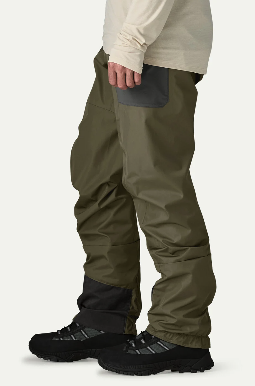 Side of model wearing  Patagonia Swiftcurrent Traverse Wading Pants