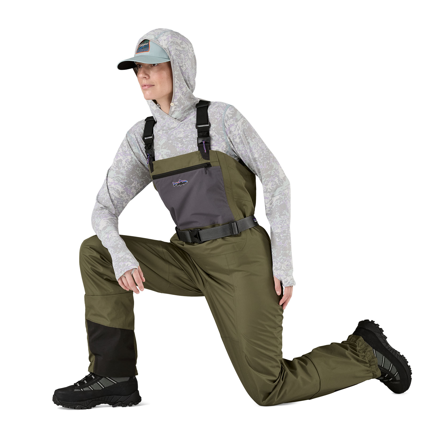 Model showing the range of motion for the Patagonia Women's Swiftcurrent Traverse Waders
