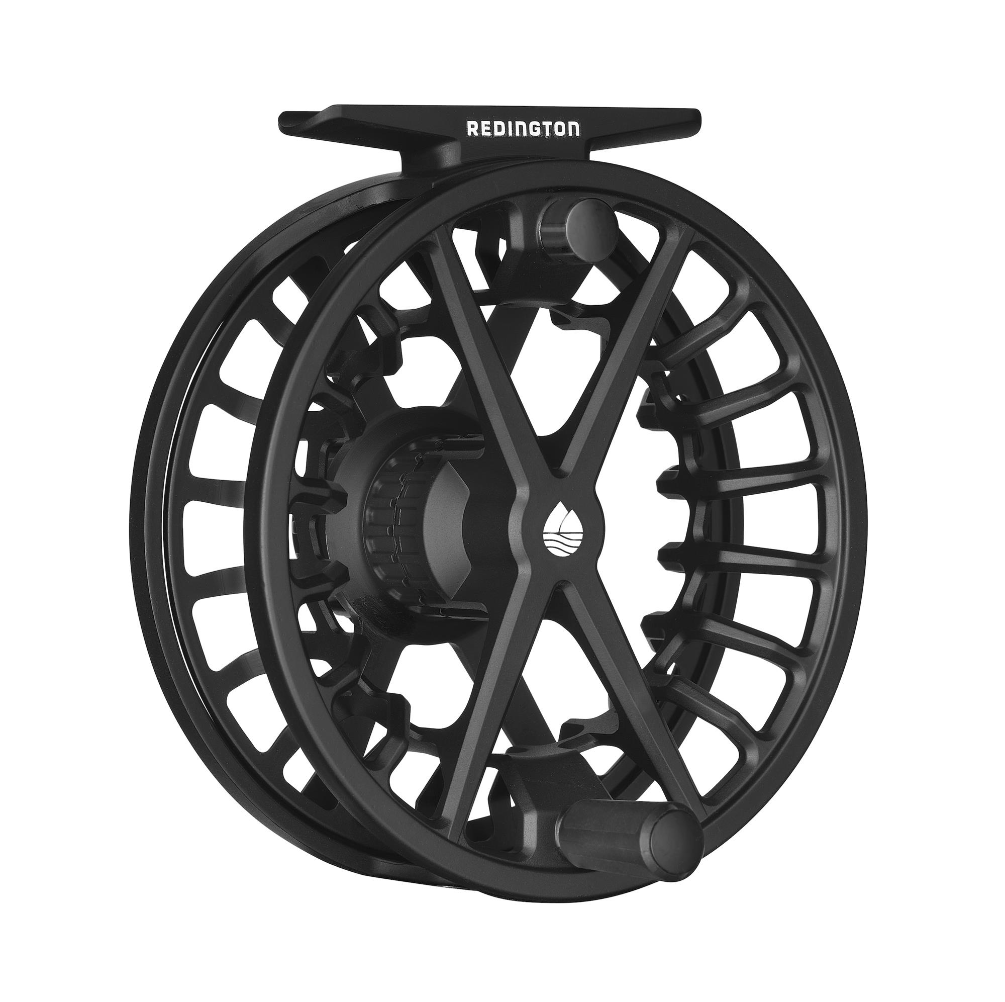 Redington Factor Black Fly Reel angled front view showing large arbor spool, ported frame, and reel handle.