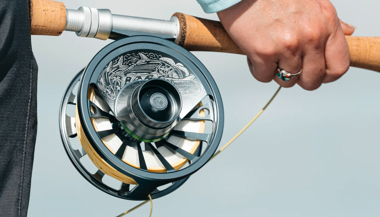Angler holding rod with Redington GRANDE 9/10/11 Limited Edition Tarpon Fly Reel