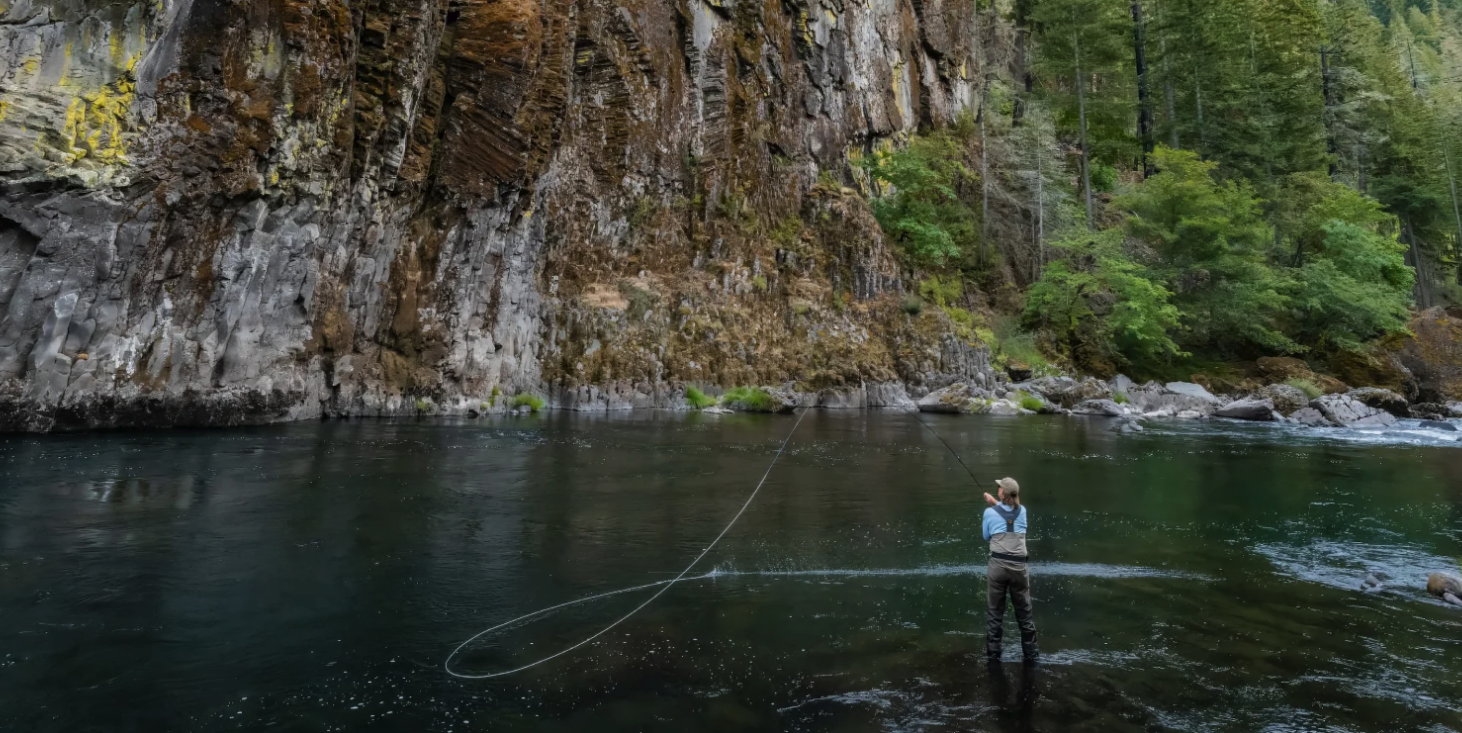 Angler casting Redington Classic Spey Fly Rod Handle in river