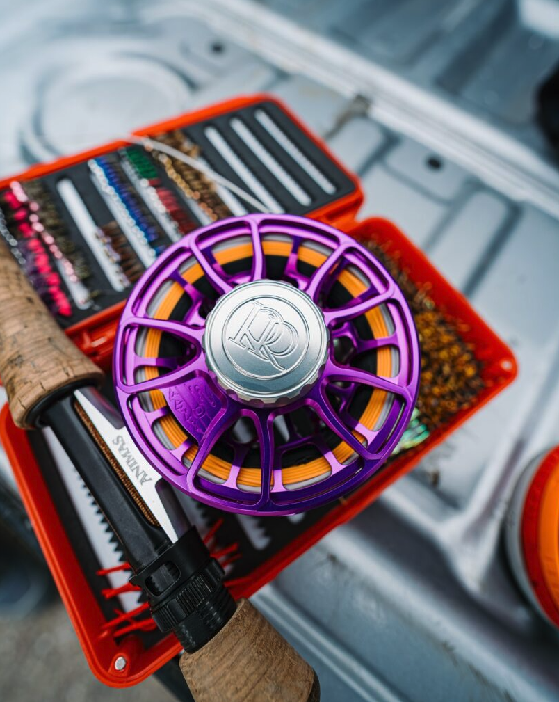 Ross Reels Animas Fly Reel Purple Limited Edition on rod by fly box