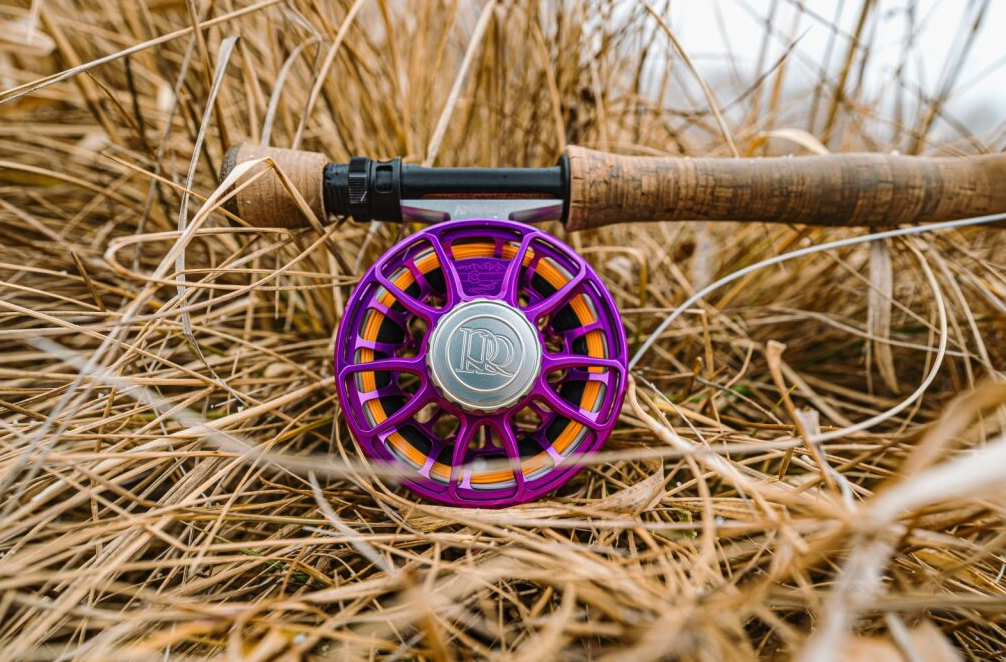 Ross Reels Animas Fly Reel Purple Limited Edition on rod in the grass