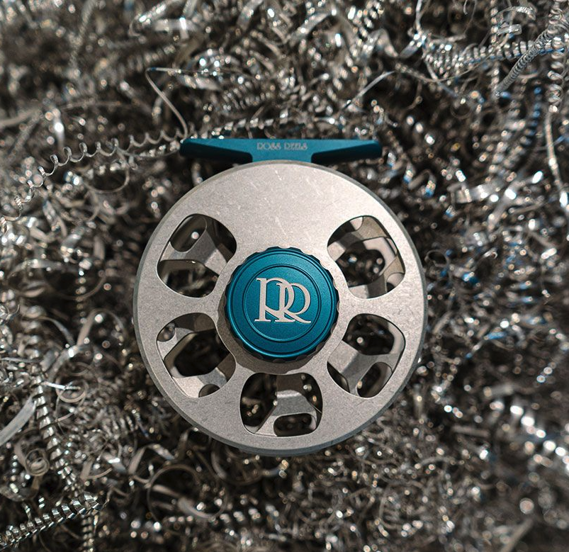 Ross Reels Cimarron Fly Reel Machinist Edition in aluminum shavings.